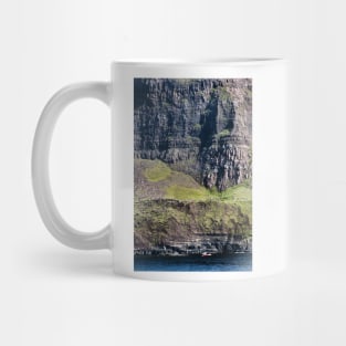 Fishing boat under high cliffs at Neist Point, Isle of Skye, Scotland Mug